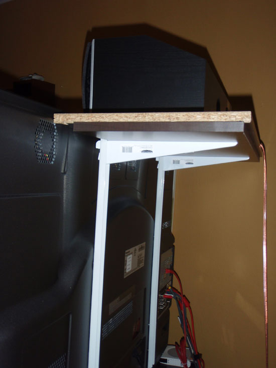 Front speaker mounted above screen